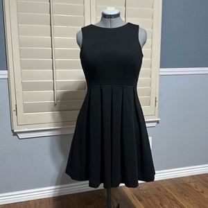 Jennifer Lopez Black fit and flare dress.